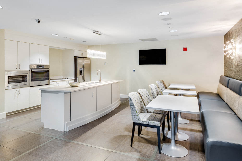 a kitchen and dining room with a table and chairs